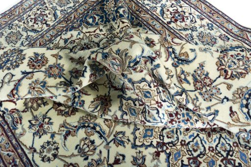 Surface texture of 2000s Nain rug with natural Wool and intricate pattern