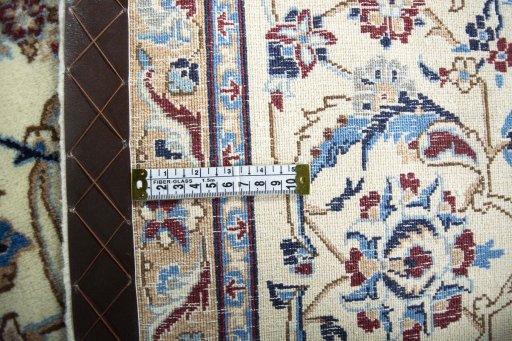 Backside of handmade 2000s Nain rug showing knot structure and weave density