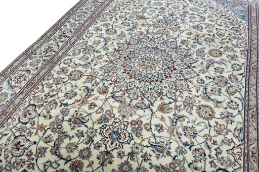 Backside of handmade 2000s Nain rug showing knot structure and weave density