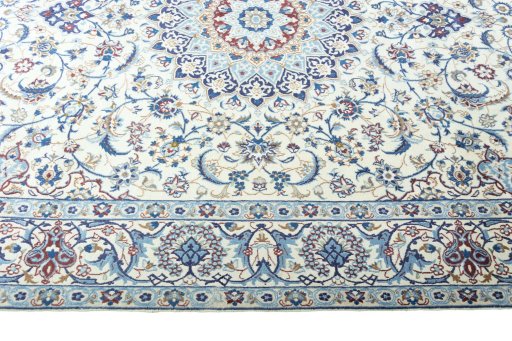 Corner detail of 2000s Nain rug showing border pattern and Wool pile