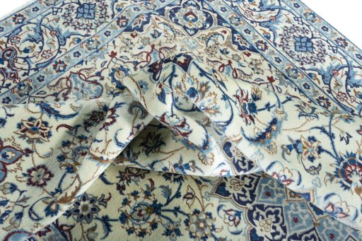 Surface texture of 2000s Nain rug with natural Wool and intricate pattern