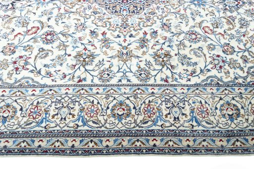 Corner detail of 2000s Nain rug showing border pattern and Wool pile
