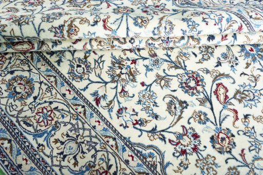 Surface texture of 2000s Nain rug with natural Wool and intricate pattern
