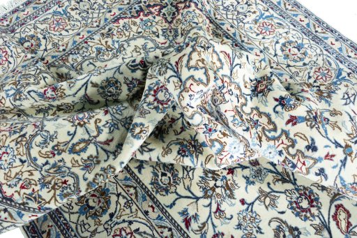 Backside of handmade 2000s Nain rug showing knot structure and weave density