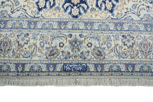 Corner detail of 2000s Nain rug showing border pattern and Wool pile