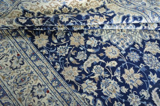 Surface texture of 2000s Nain rug with natural Wool and intricate pattern