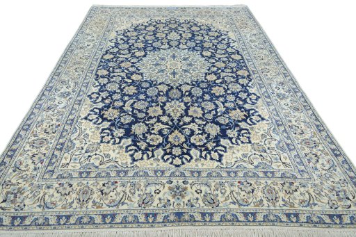 Surface texture of 2000s Nain rug with natural Wool and intricate pattern