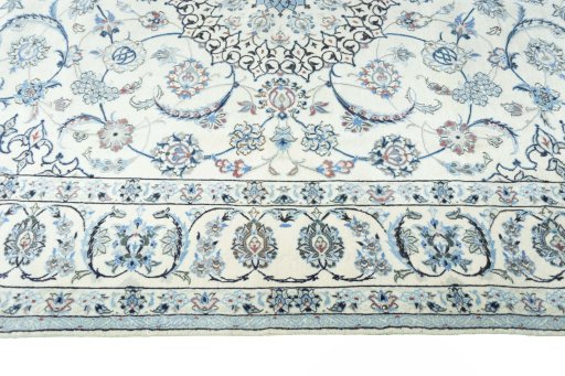 Corner detail of 2000s Nain rug showing border pattern and Wool pile