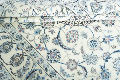 Surface texture of 2000s Nain rug with natural Wool and intricate pattern