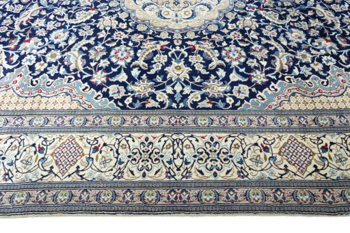 Corner detail of 2000s Nain rug showing border pattern and Wool pile