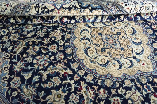 Close-up detail of 2000s Nain rug from Iran / Persia showing Wool weave