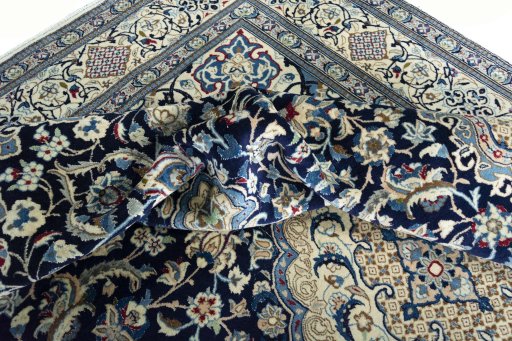 Surface texture of 2000s Nain rug with natural Wool and intricate pattern