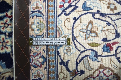 Backside of handmade 2000s Nain rug showing knot structure and weave density