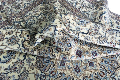 Surface texture of 2000s Nain rug with natural Wool and intricate pattern