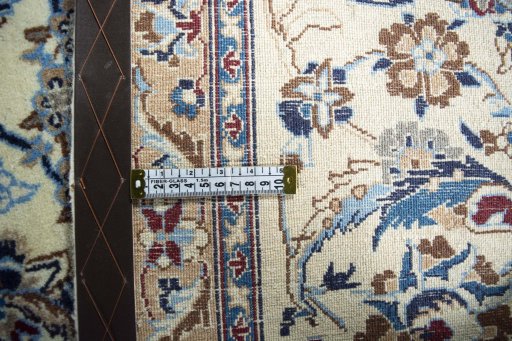 Backside of handmade 2000s Nain rug showing knot structure and weave density