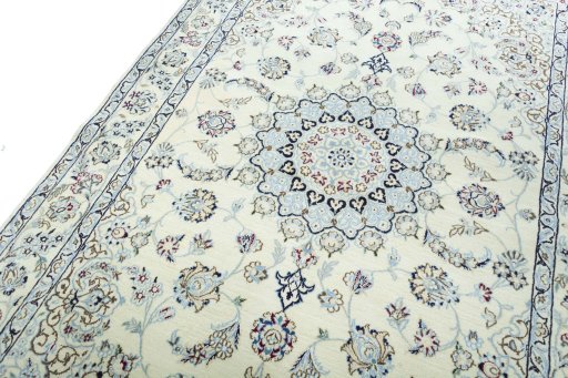Backside of handmade New Nain rug showing knot structure and weave density