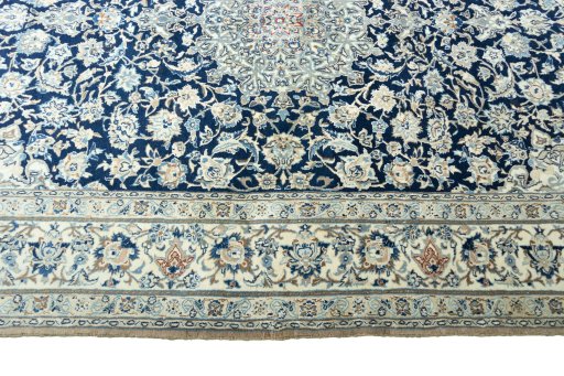 Corner detail of 1970s Nain rug showing border pattern and Cork pile