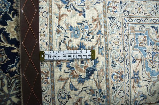 Backside of handmade 1970s Nain rug showing knot structure and weave density