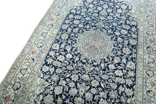 Backside of handmade 1970s Nain rug showing knot structure and weave density