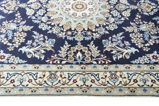 Corner detail of 2000s Nain rug showing border pattern and Wool pile