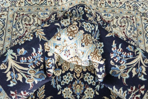 Surface texture of 2000s Nain rug with natural Wool and intricate pattern