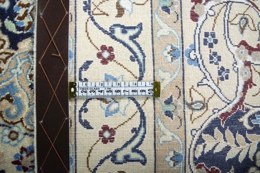 Backside of handmade 2000s Nain rug showing knot structure and weave density