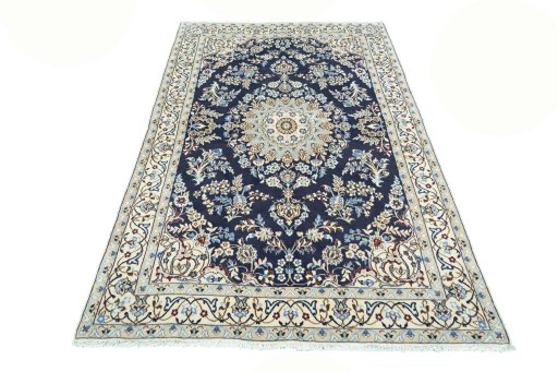 Surface texture of 2000s Nain rug with natural Wool and intricate pattern