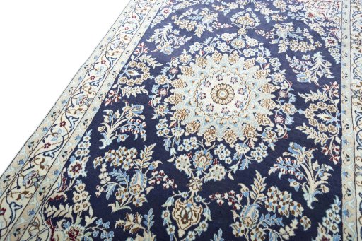Backside of handmade 2000s Nain rug showing knot structure and weave density