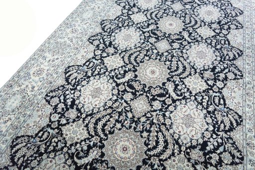 Backside of handmade New Nain rug showing knot structure and weave density