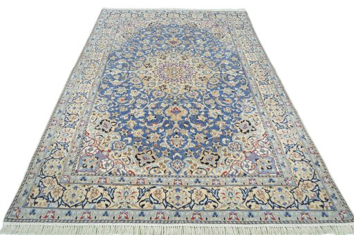 Surface texture of 2000s Nain rug with natural Wool and intricate pattern