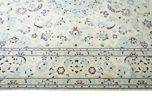 Corner detail of New Nain rug showing border pattern and Wool pile