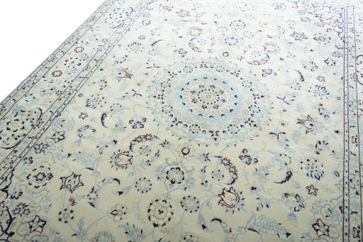 Backside of handmade New Nain rug showing knot structure and weave density