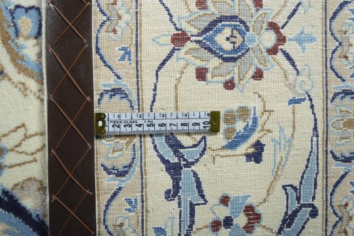 Backside of handmade 2000s Nain rug showing knot structure and weave density