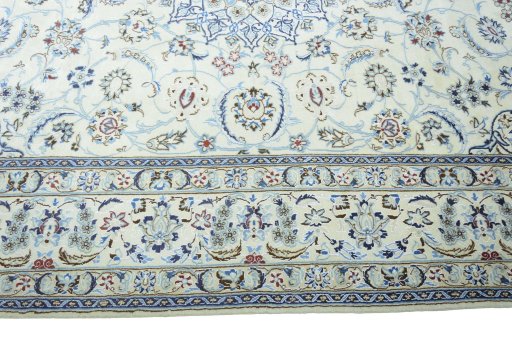Corner detail of 2000s Nain rug showing border pattern and Wool pile