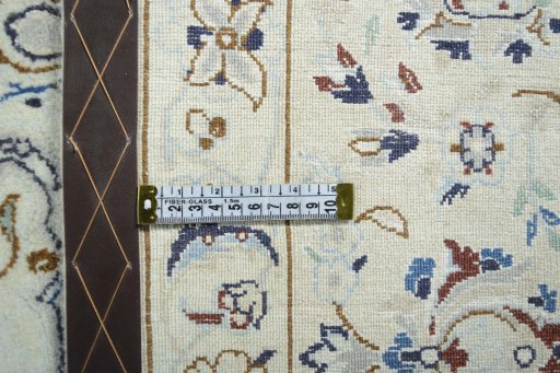 Backside of handmade 2000s Nain rug showing knot structure and weave density