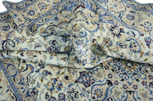 Backside of handmade 2000s Nain rug showing knot structure and weave density
