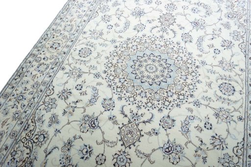 Backside of handmade New Nain rug showing knot structure and weave density