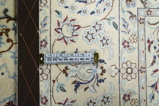 Backside of handmade New Nain rug showing knot structure and weave density