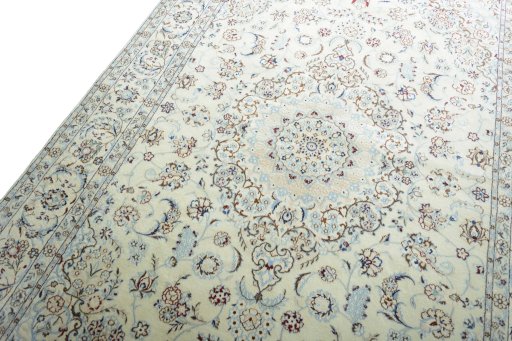 Backside of handmade New Nain rug showing knot structure and weave density