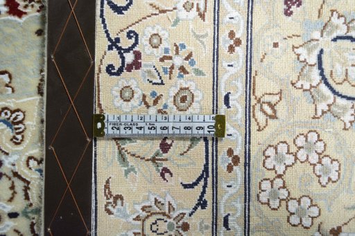 Backside of handmade New Nain rug showing knot structure and weave density