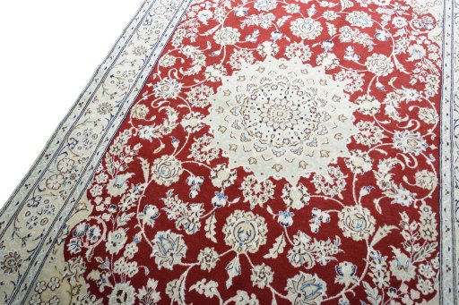 Backside of handmade New Nain rug showing knot structure and weave density