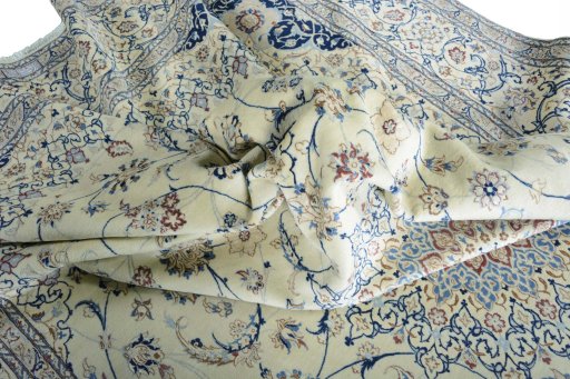 Surface texture of 2000s Nain rug with natural Cork and intricate pattern