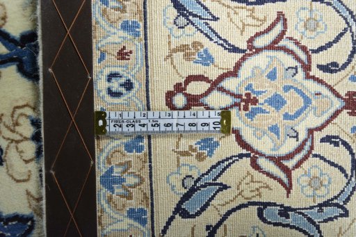 Backside of handmade New Nain rug showing knot structure and weave density