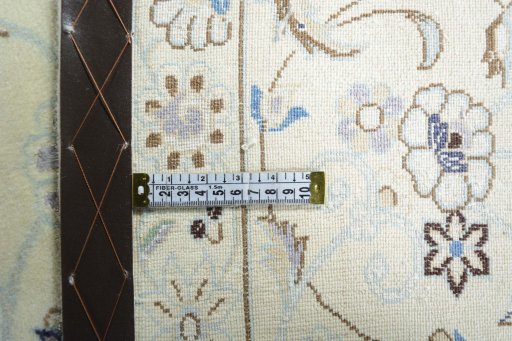 Backside of handmade New Nain rug showing knot structure and weave density