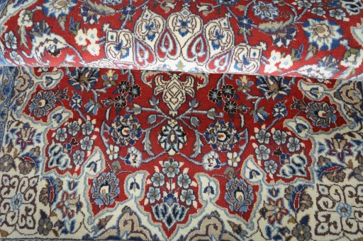 Corner detail of 2000s Nain rug showing border pattern and Wool pile