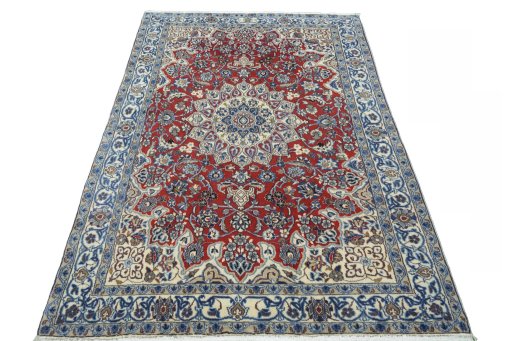 Surface texture of 2000s Nain rug with natural Wool and intricate pattern