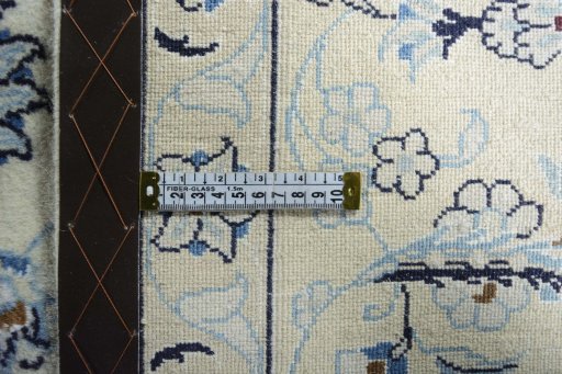 Backside of handmade New Nain rug showing knot structure and weave density