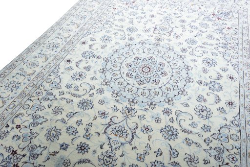 Backside of handmade New Nain rug showing knot structure and weave density