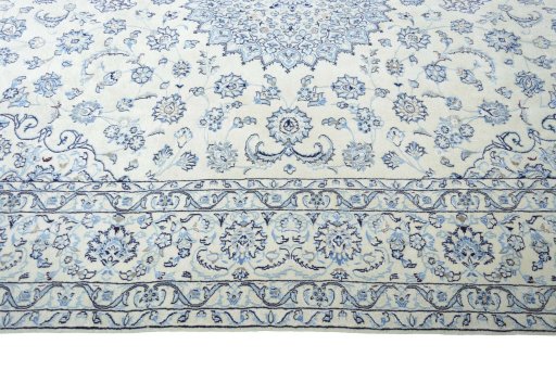 Corner detail of New Nain rug showing border pattern and Wool pile