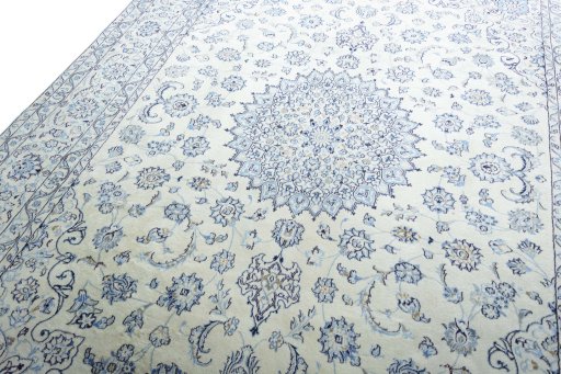 Backside of handmade New Nain rug showing knot structure and weave density